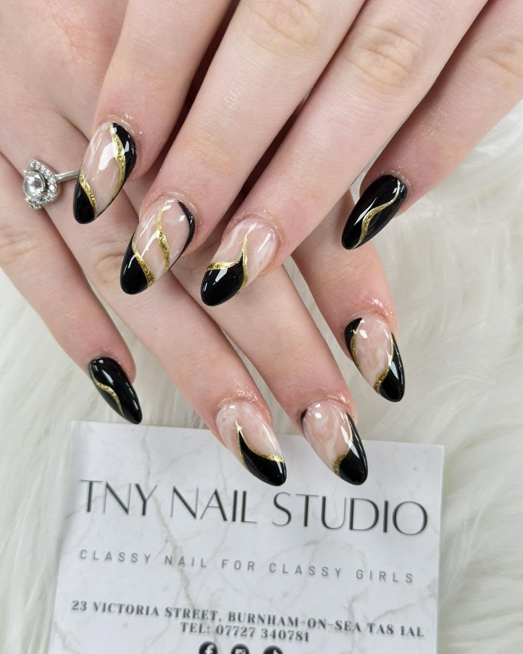 Black and gold graphic manicure