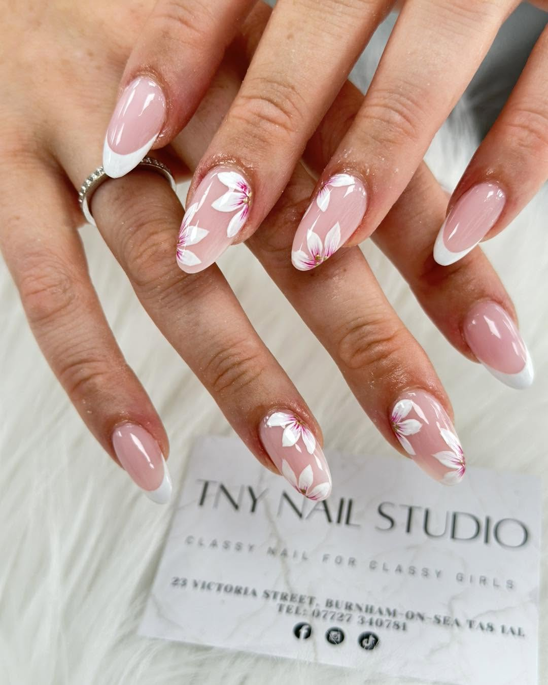 White French manicure with hand-painted floral details
