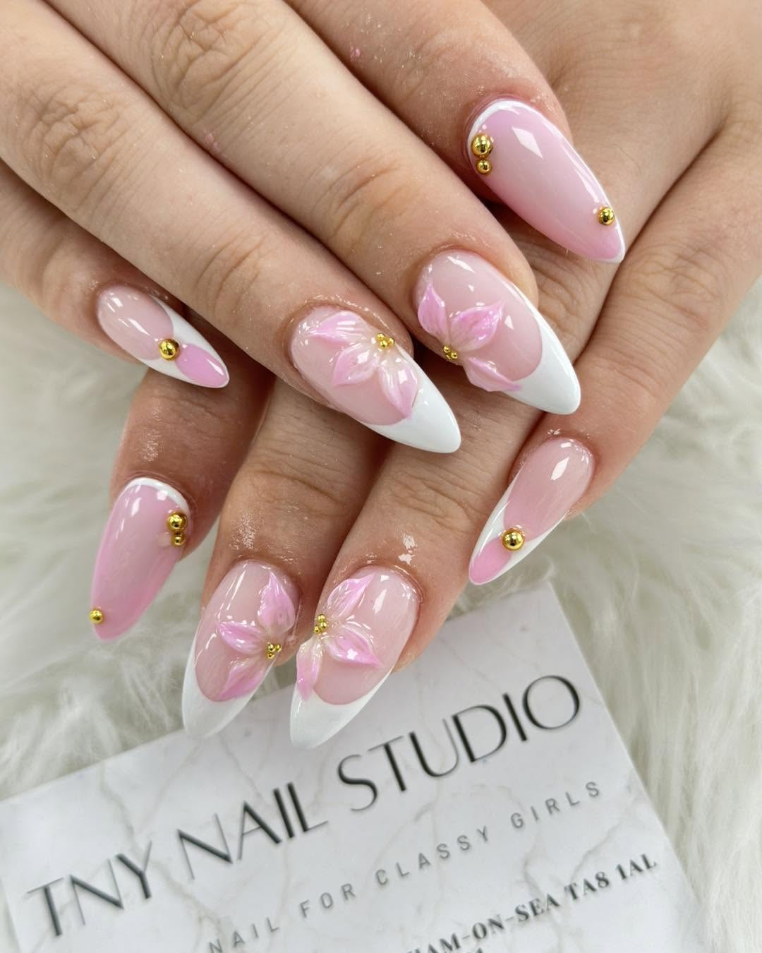 Pink and white manicure with sculpted flowers